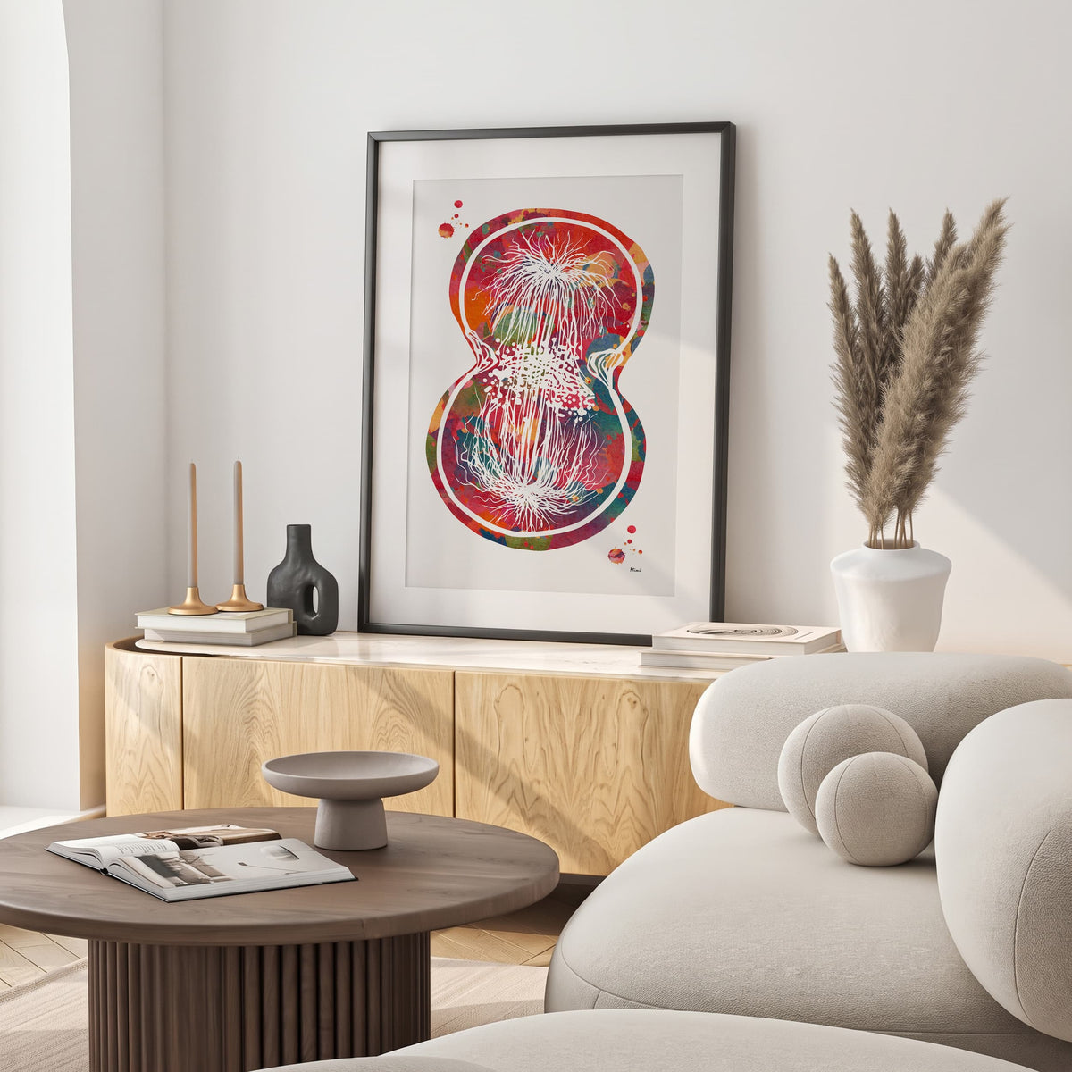 Framed cell division watercolor print in a warm living room