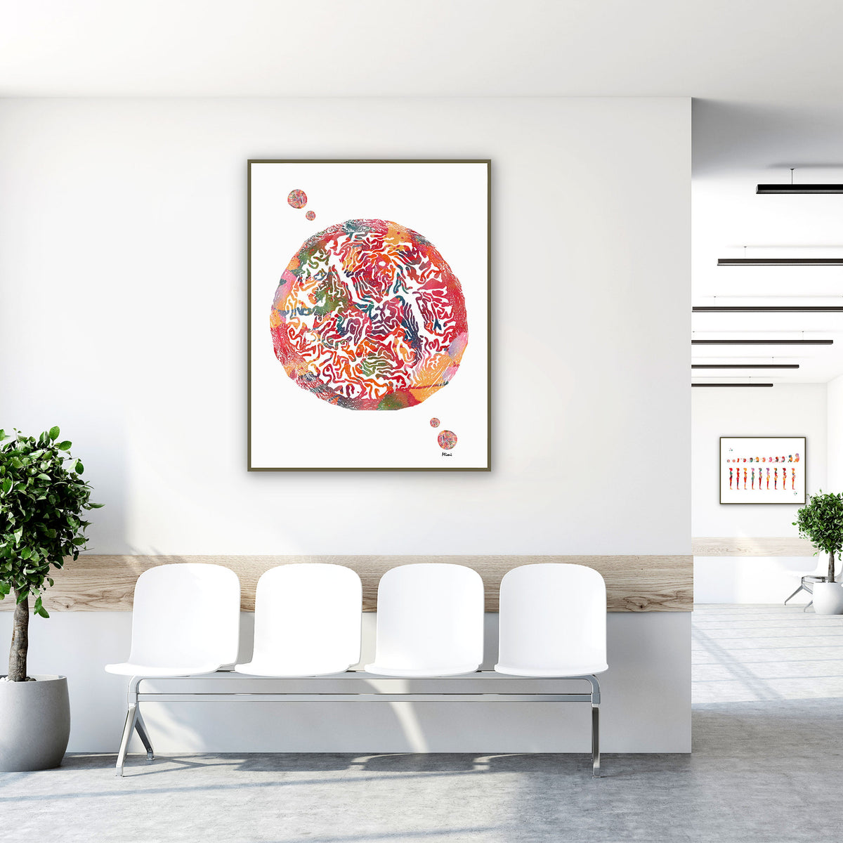 Framed fallopian tube anatomy watercolor print in a clinic waiting room