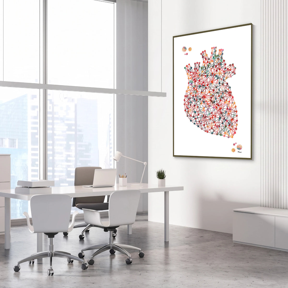 Framed minimalist geometric anatomical heart watercolor print in a cardiology clinic