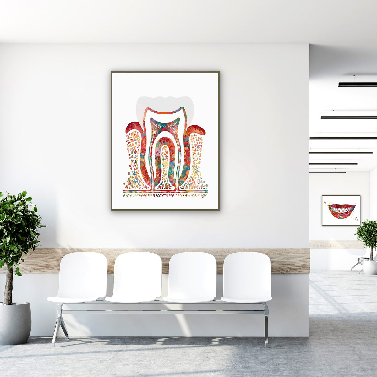 Framed molar cross-section watercolor print in a clinic waiting room