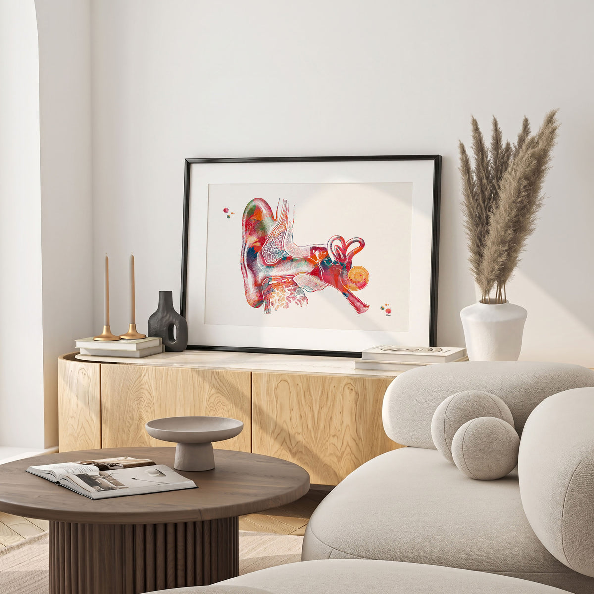 Framed outer ear anatomy watercolor print in a warm living room