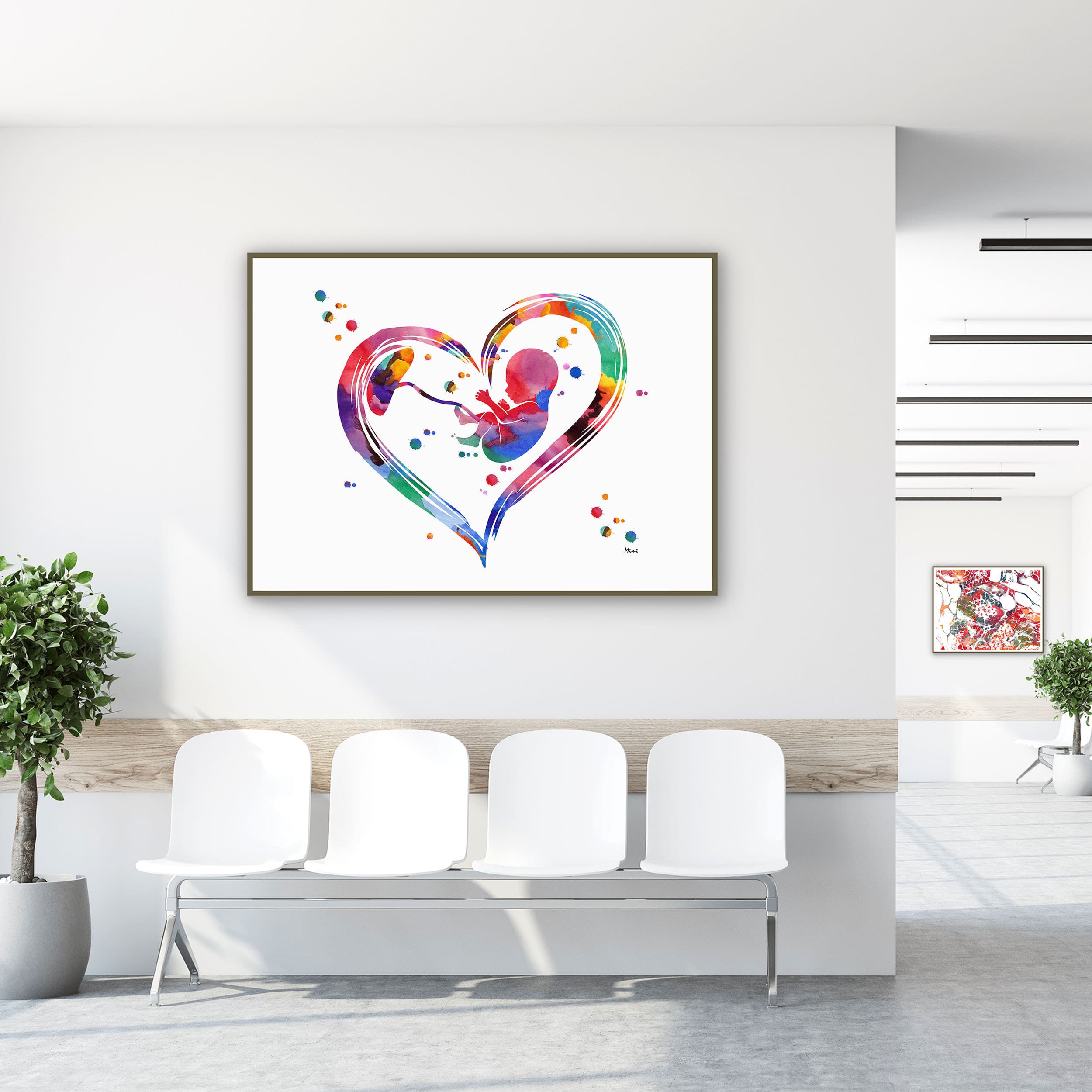 Framed prenatal care fetal growth & placenta watercolor print in a clinic waiting room