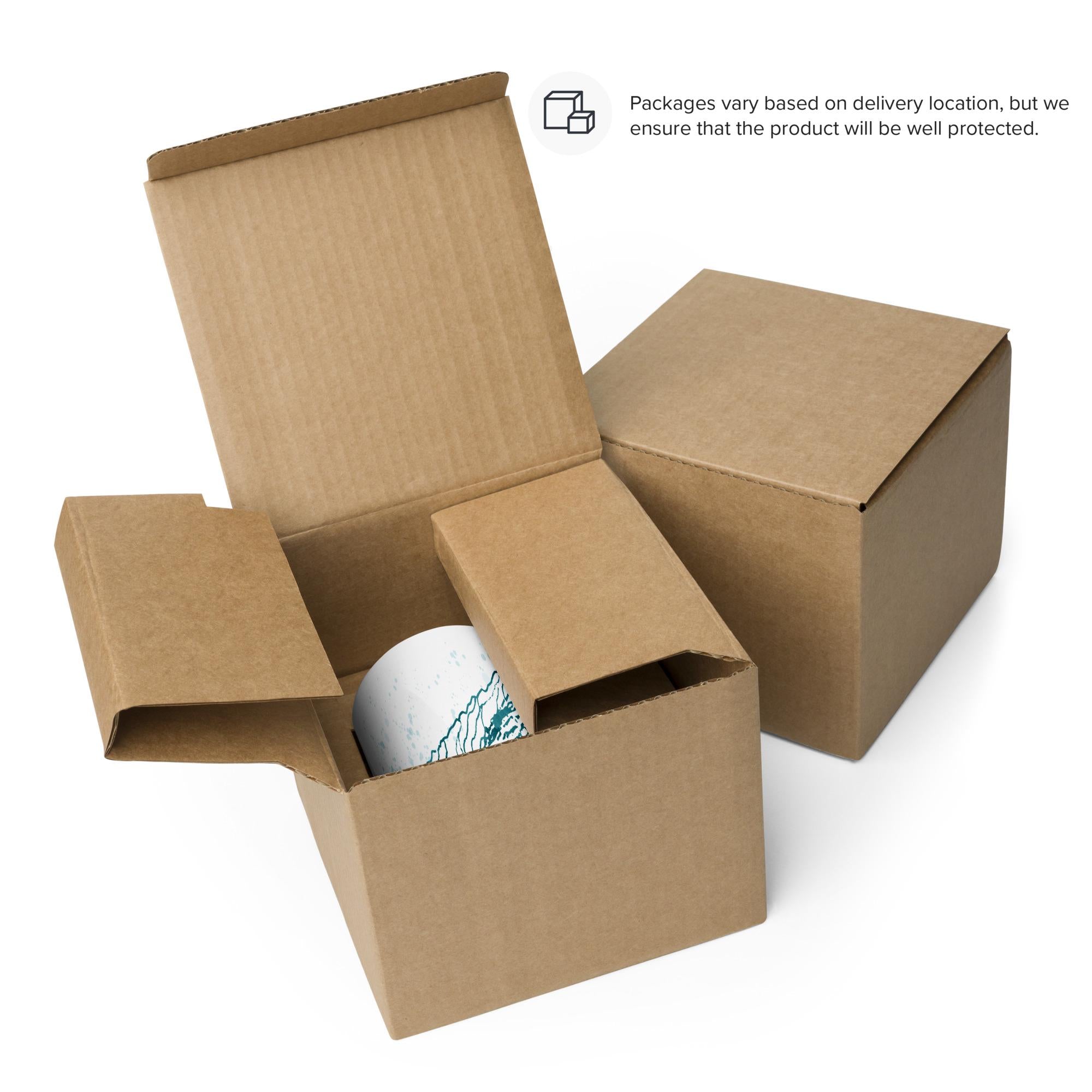 safe packaging of the Fovea Watercolor design painted in blue- teal on a white glossy ceramics mug