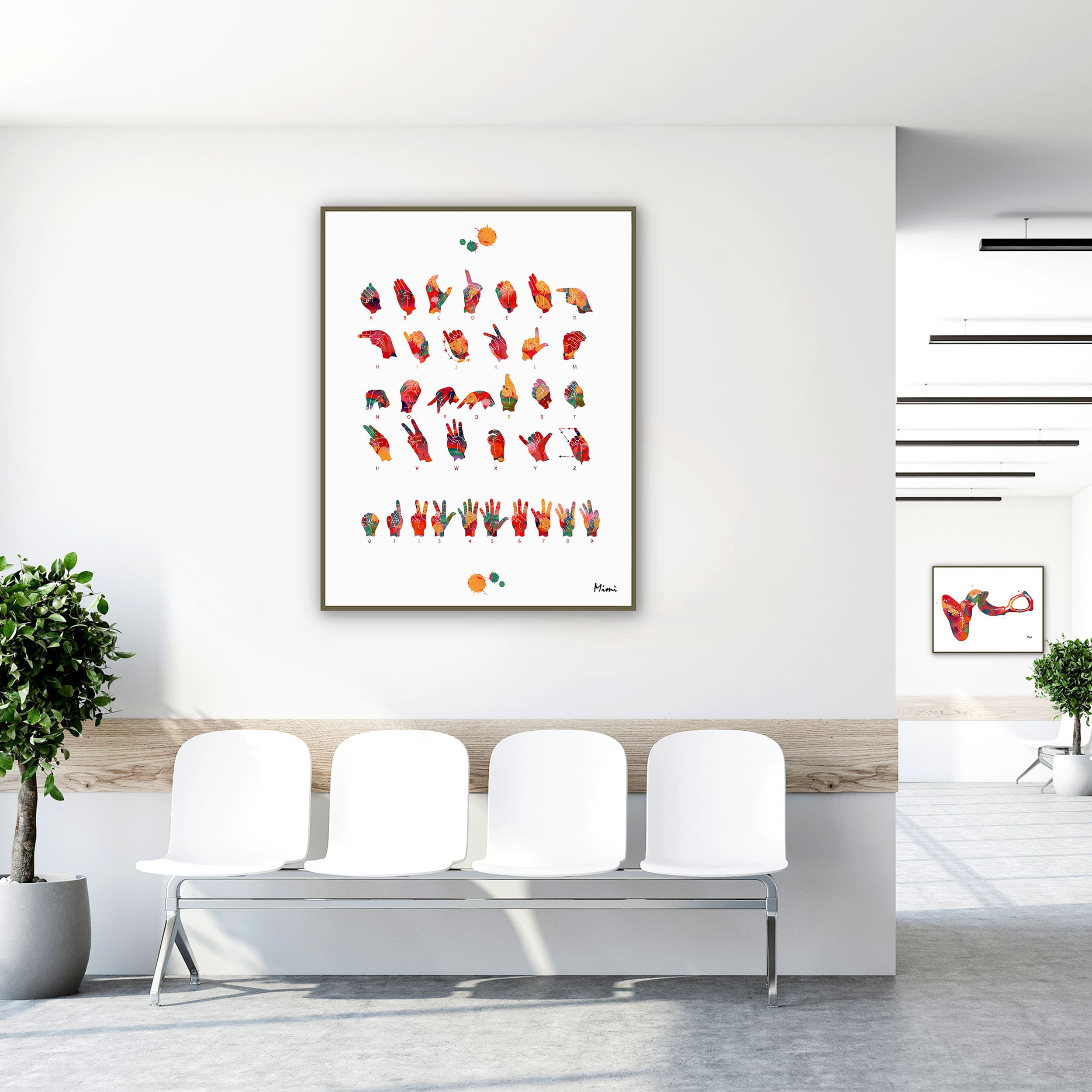 Framed asl alphabet watercolor print in a clinic waiting room
