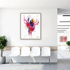 Framed bold modern anatomical heart watercolor print in a clinic waiting room