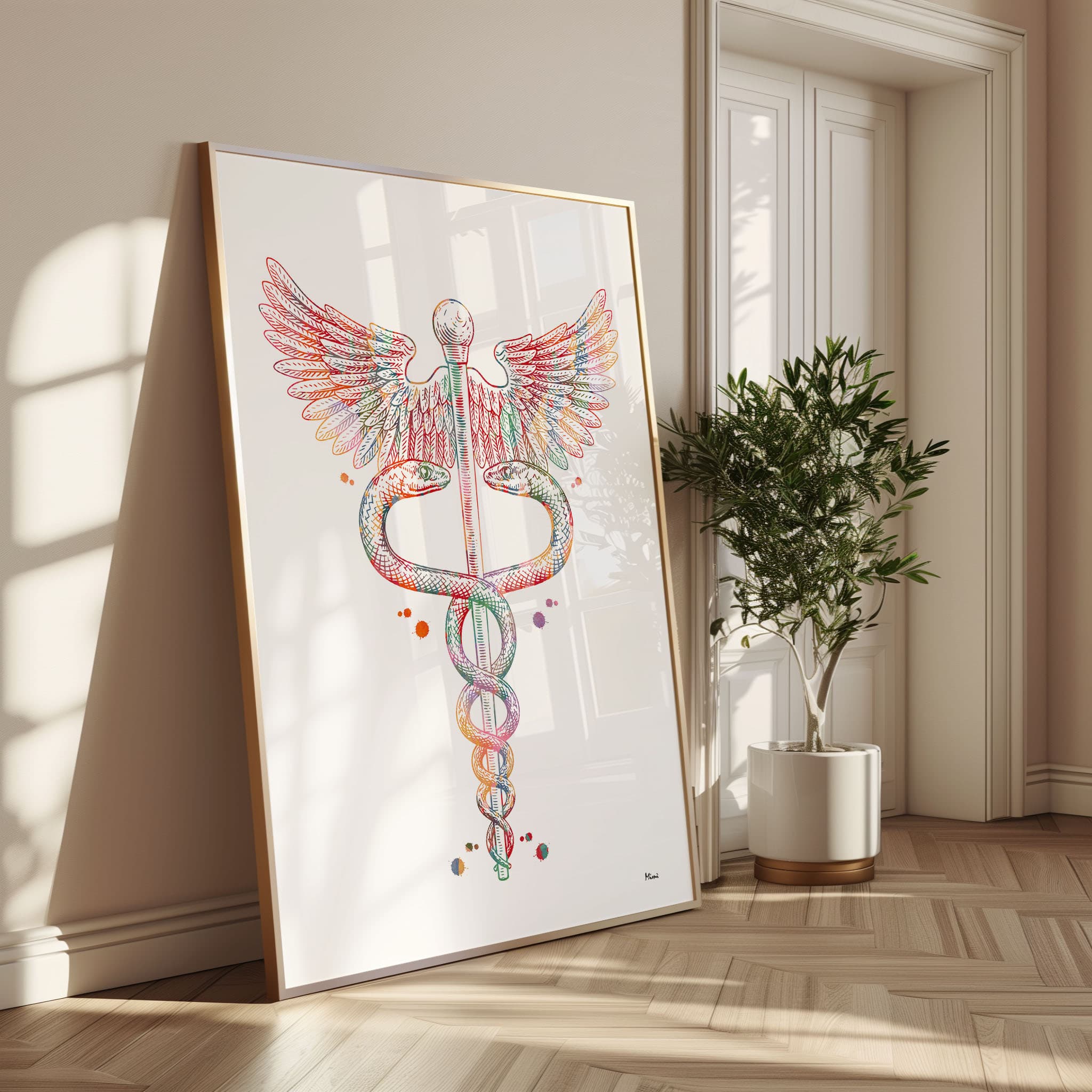 Framed caduceus symbol watercolor print in a warm living room