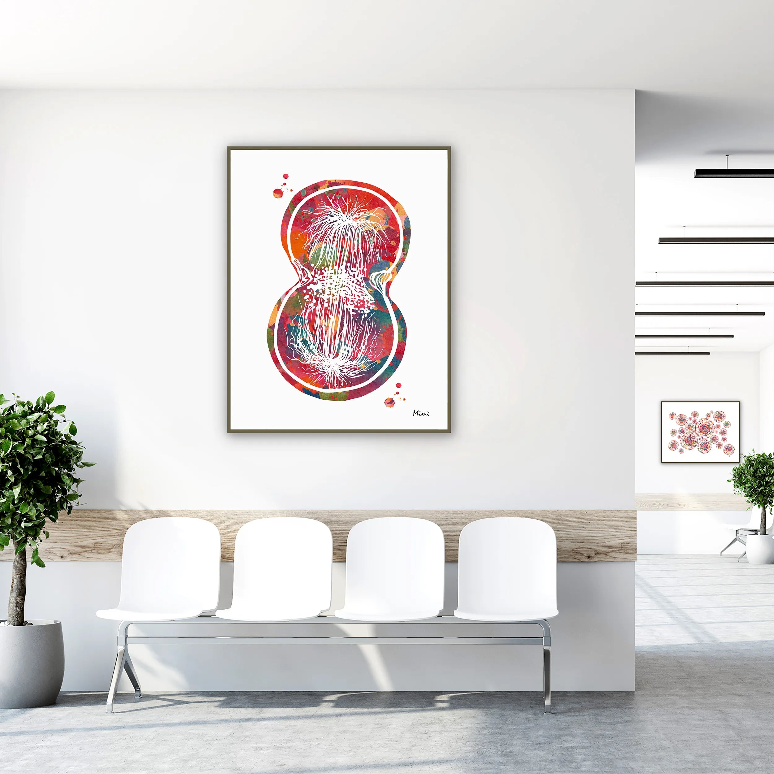 Framed cell division watercolor print in a clinic waiting room
