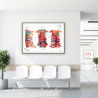 Framed cervical spine anatomy watercolor print in a clinic waiting room
