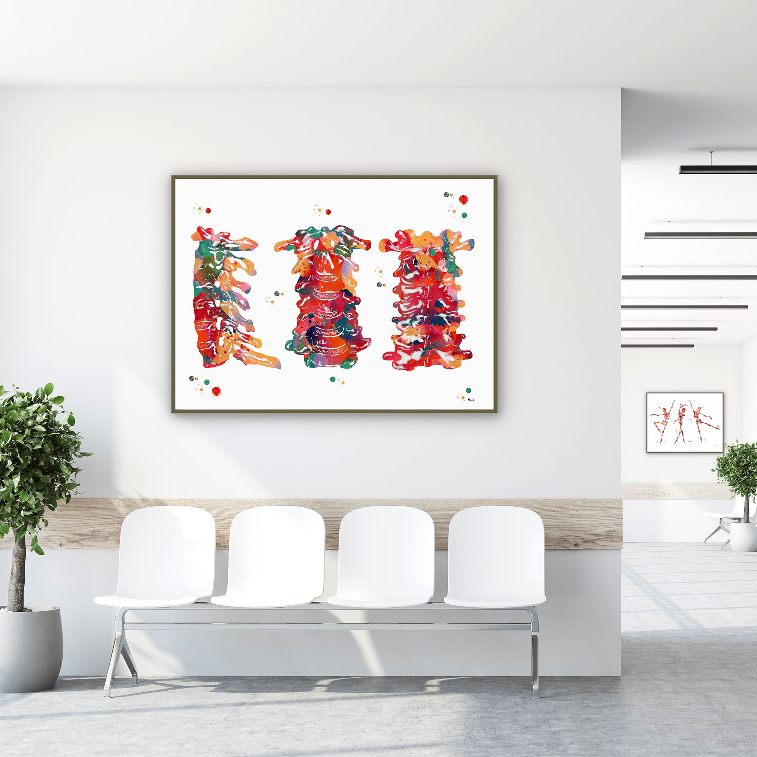 Framed cervical spine anatomy watercolor print in a clinic waiting room