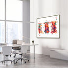 Framed cervical spine anatomy watercolor print in an orthopedic clinic