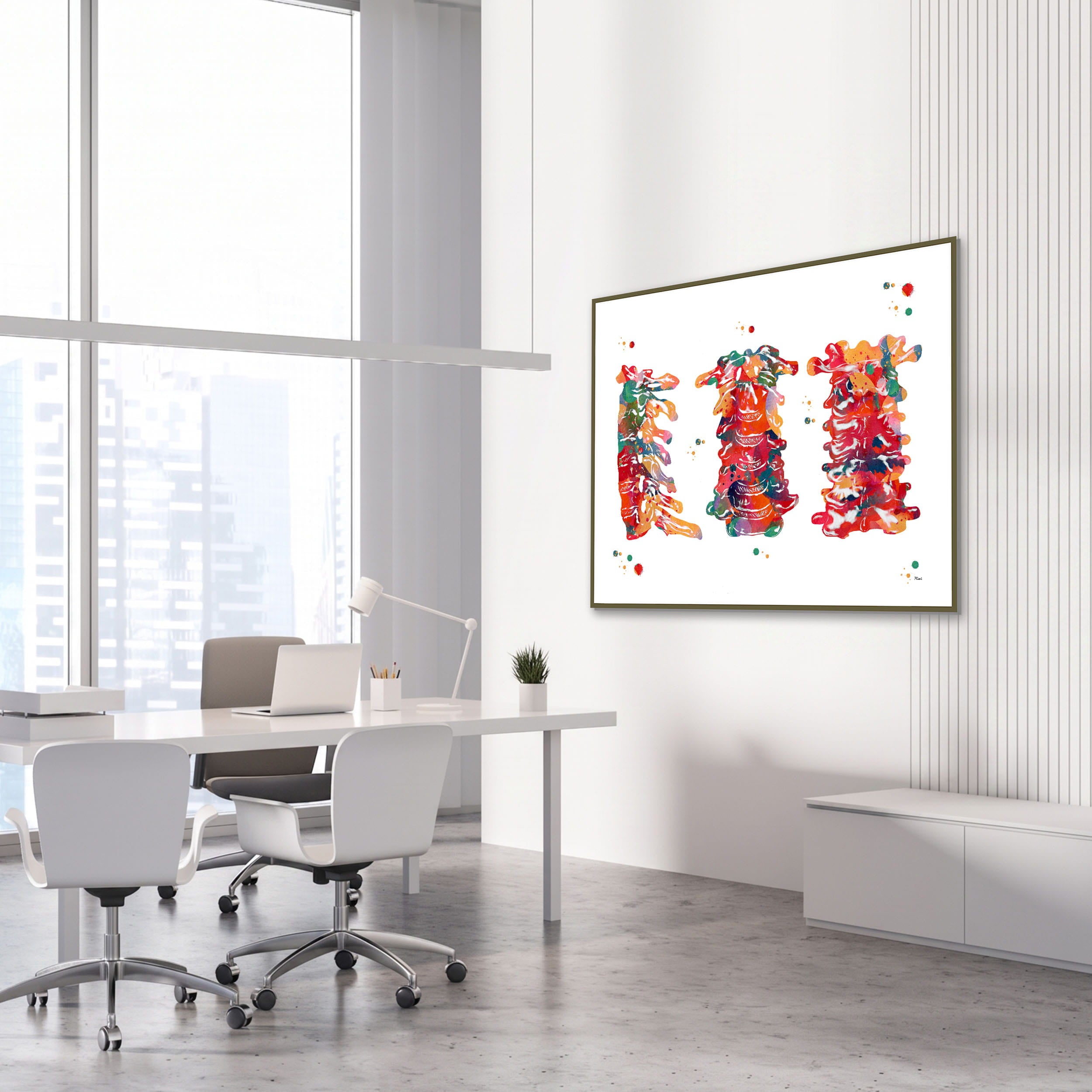 Framed cervical spine anatomy watercolor print in an orthopedic clinic