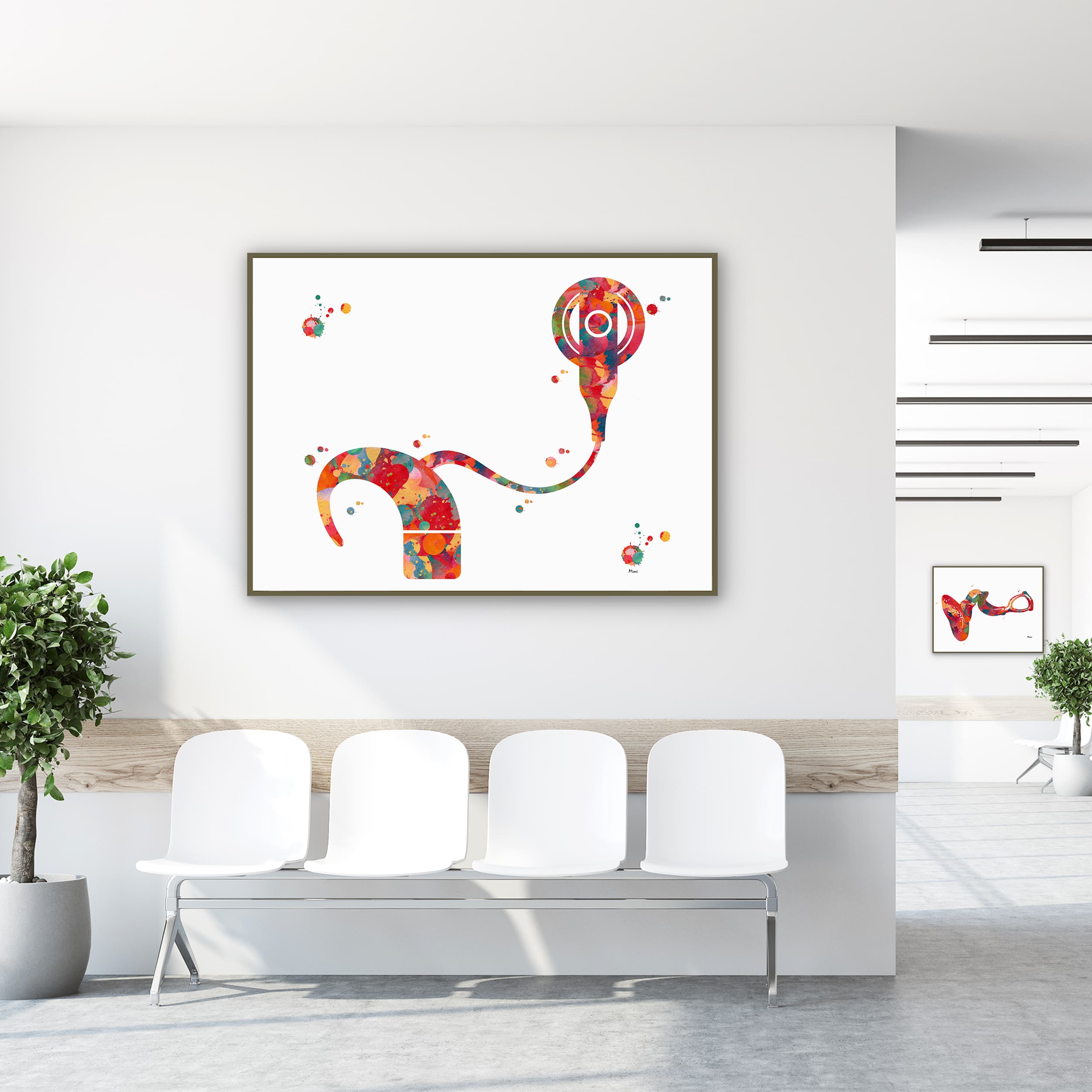 Framed cochlear implant watercolor print in a clinic waiting room