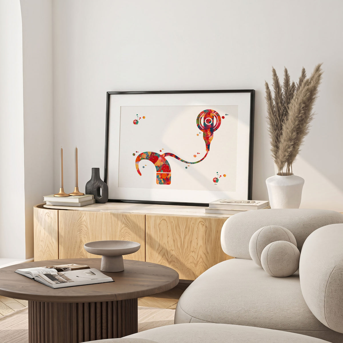 Framed cochlear implant watercolor print in a warm living room