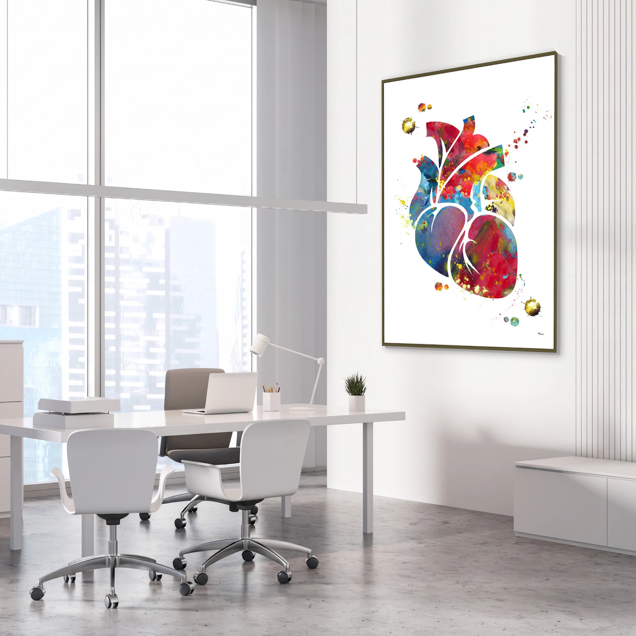 Framed colorful anatomical heart watercolor print in a cardiology clinic
