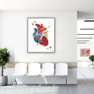 Framed colorful anatomical heart watercolor print in a clinic waiting room