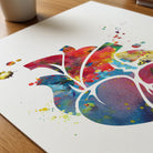 Close-up of colorful anatomical heart watercolor print showing paper texture and grain