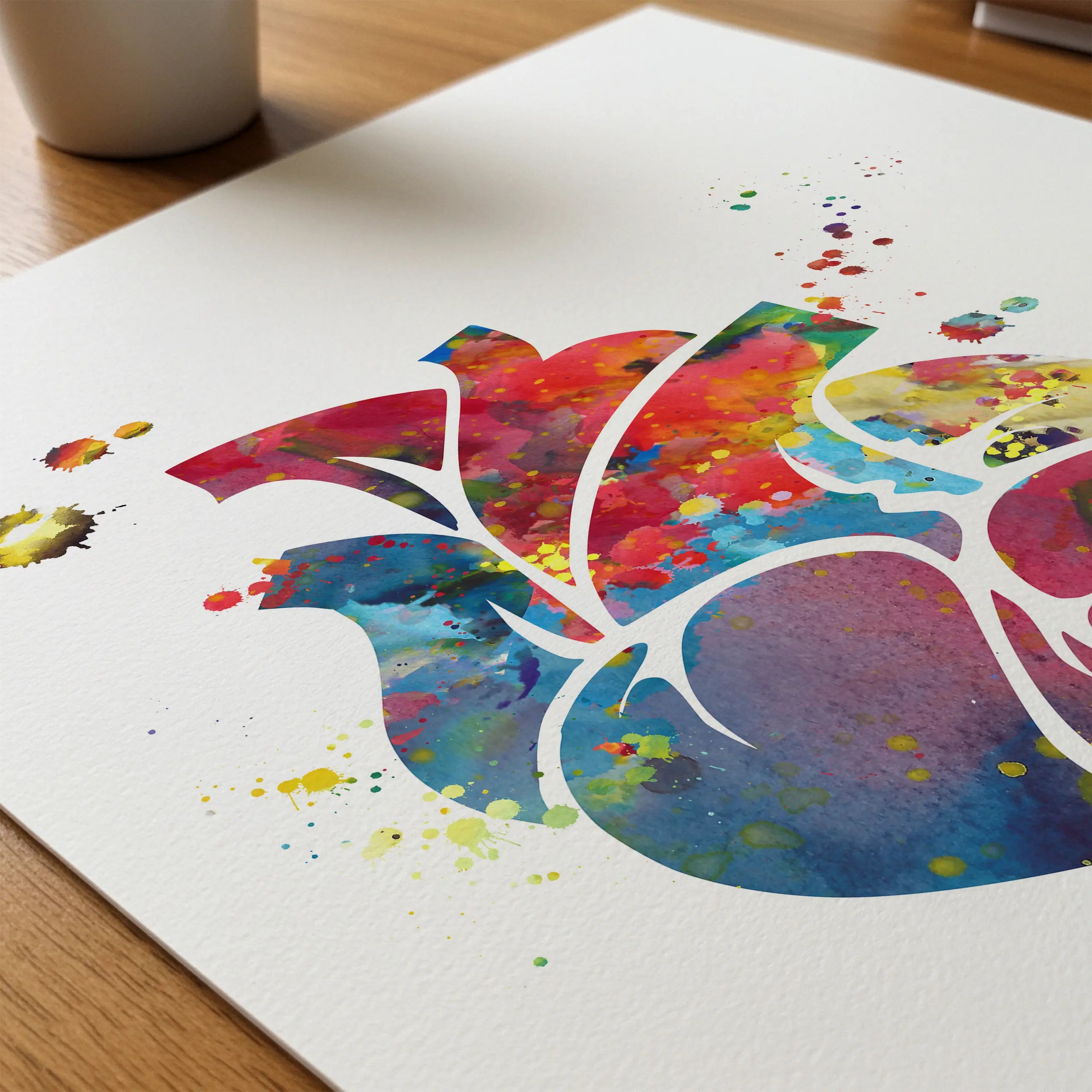 Close-up of colorful anatomical heart watercolor print showing paper texture and grain