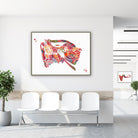 Framed ear cross-section watercolor print in a clinic waiting room