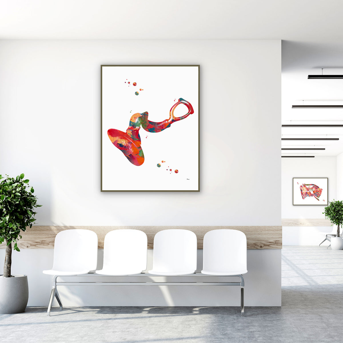 Framed eardrum anatomy watercolor print in a clinic waiting room