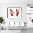 Framed foot & hand bones watercolor print in a clinic waiting room