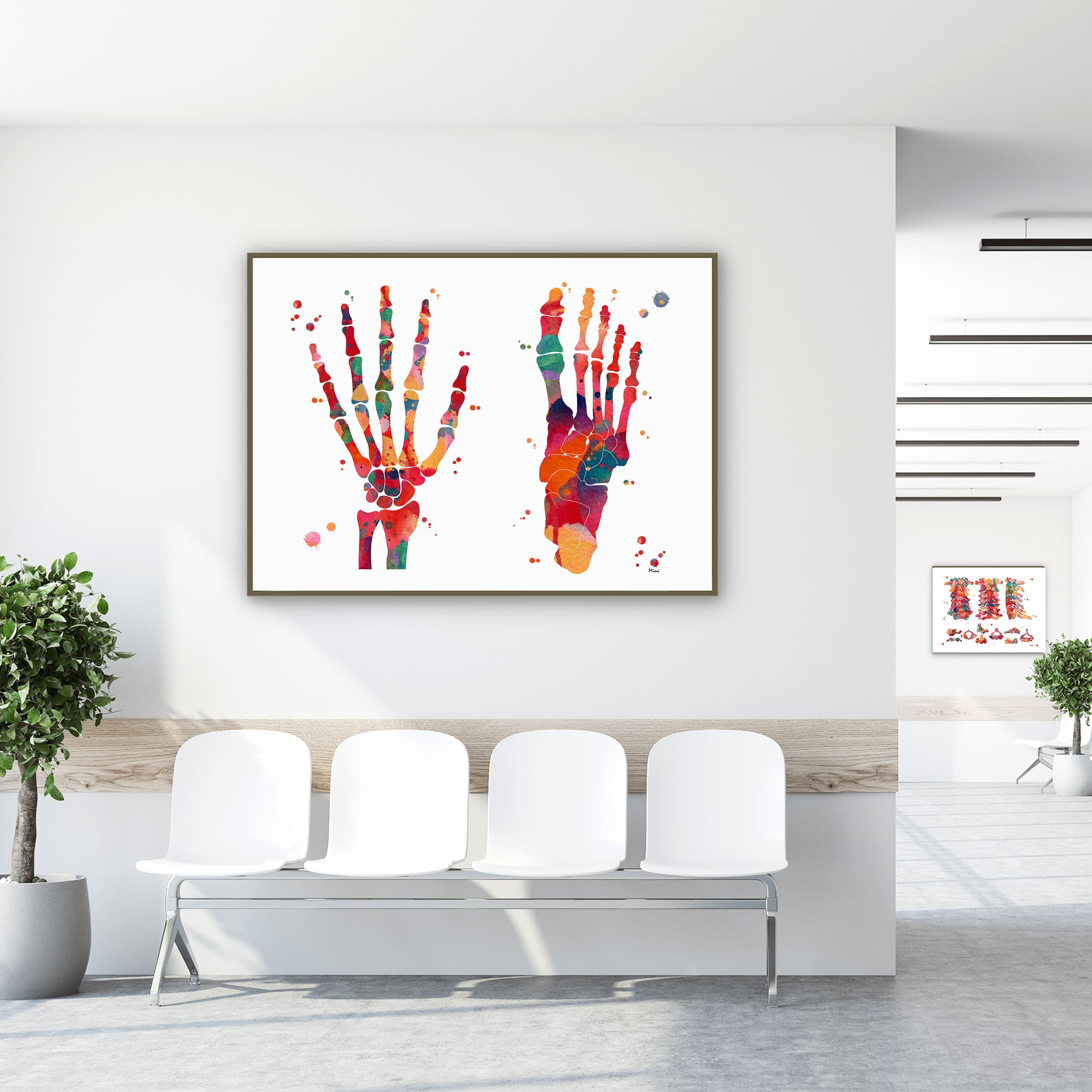Framed foot & hand bones watercolor print in a clinic waiting room