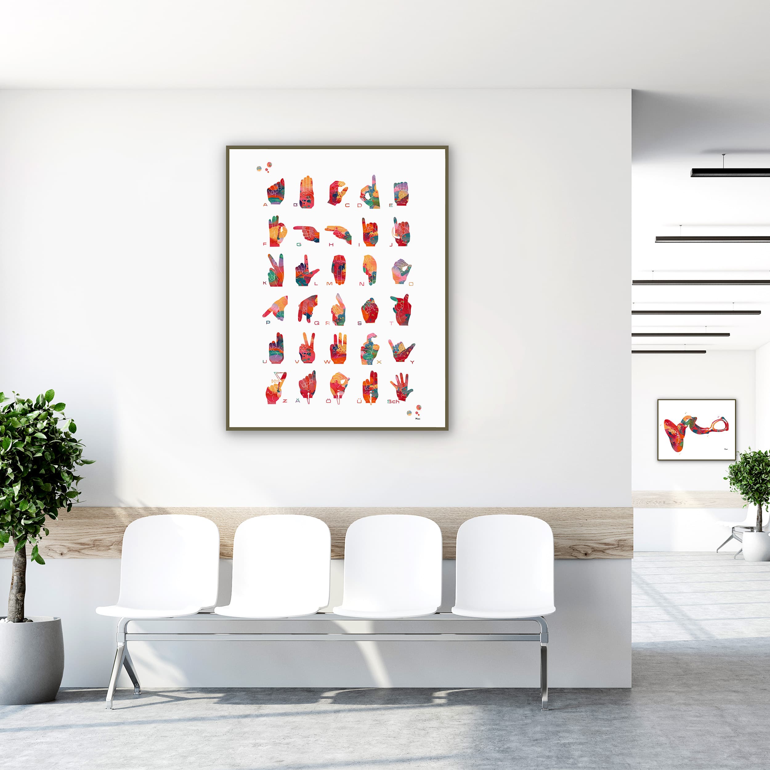 Framed german fingerspelling alphabet watercolor print in a clinic waiting room