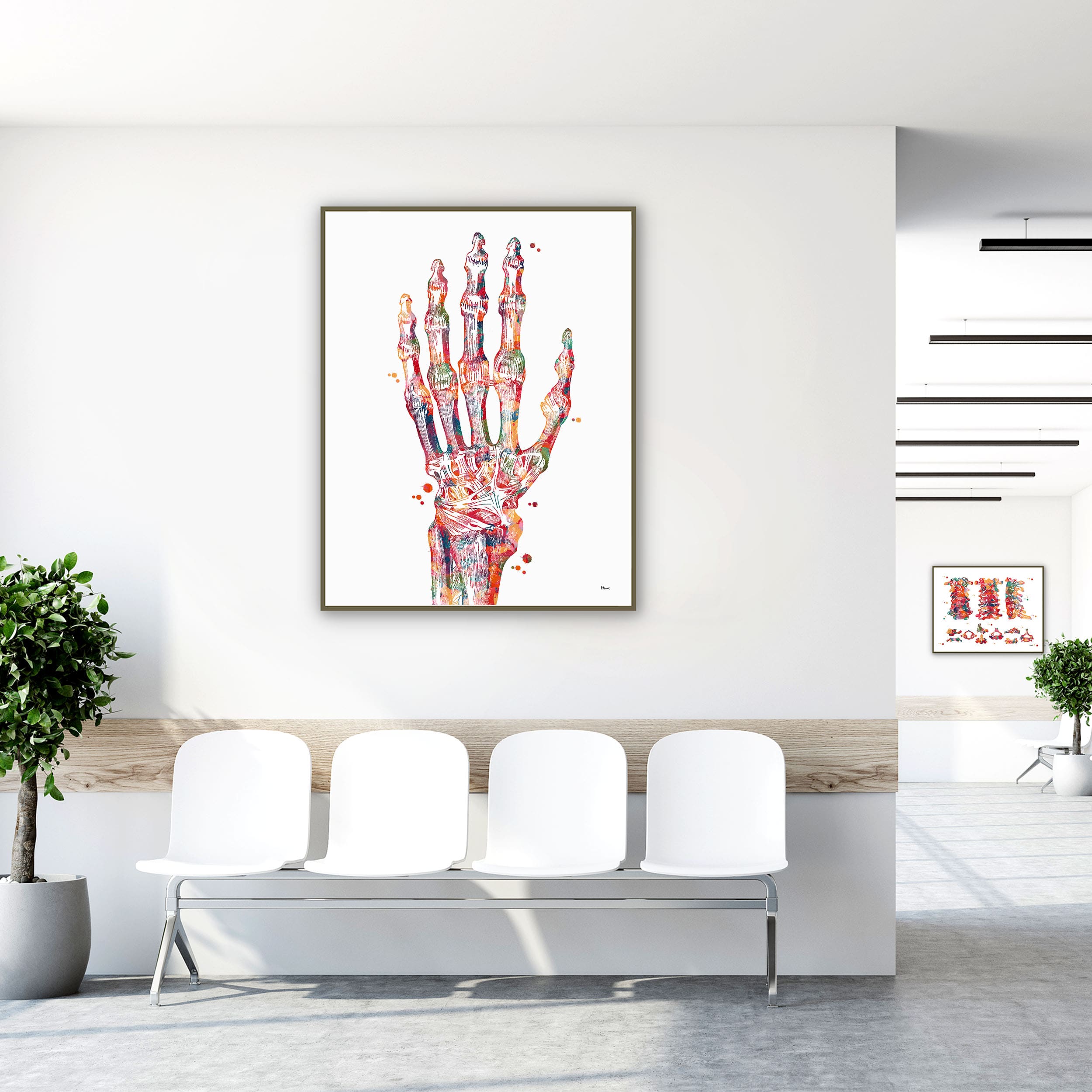 Framed hand & radiocarpal joint watercolor print in a clinic waiting room