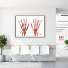 Framed hand bones & joints watercolor print in a clinic waiting room