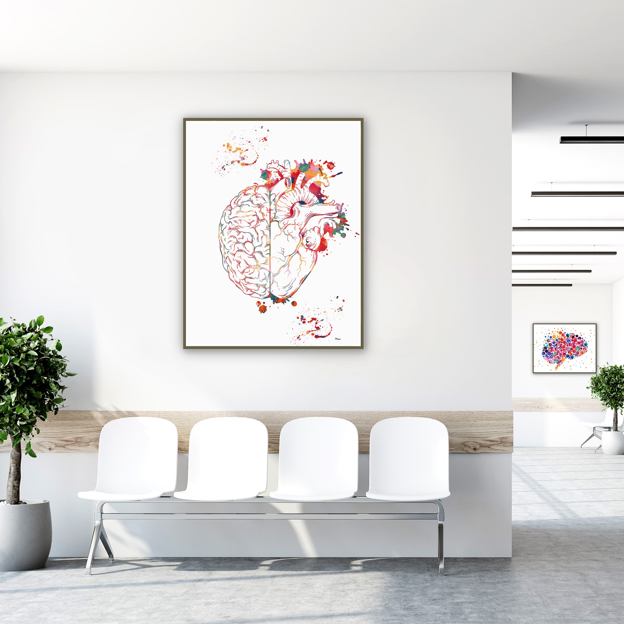 Framed heart & brain balance watercolor print in a clinic waiting room