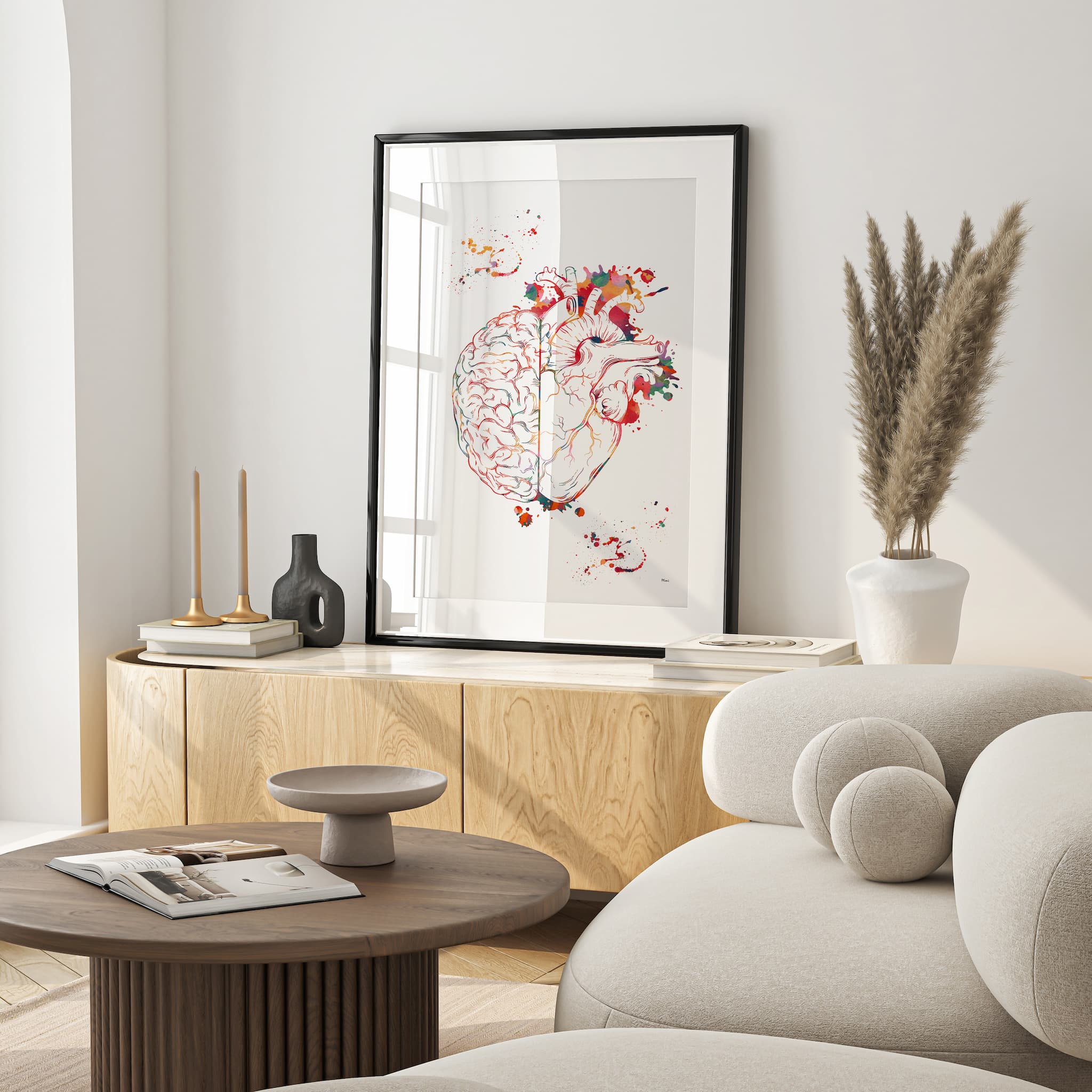 Framed heart & brain balance watercolor print in a warm living room