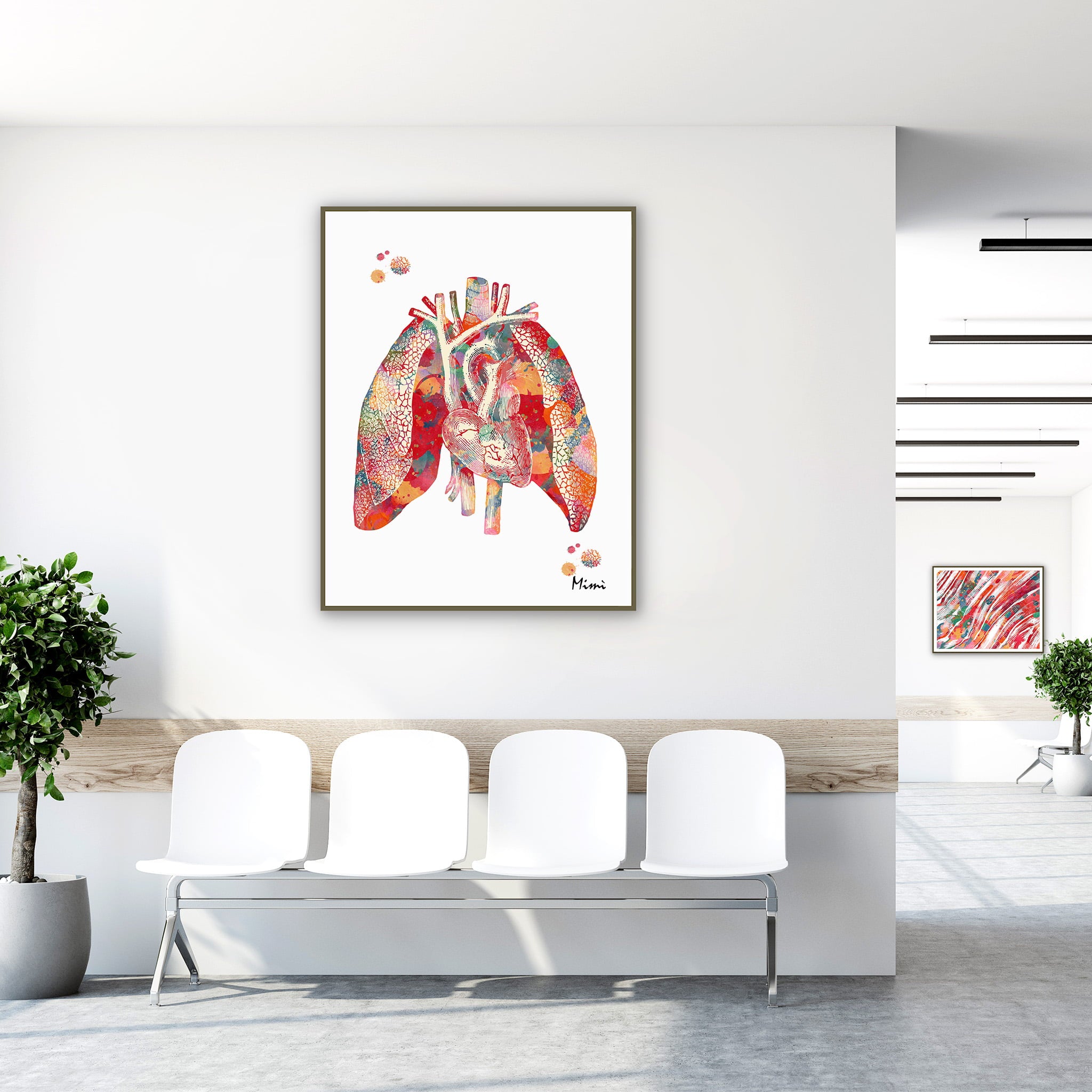Framed heart and lungs watercolor print in a clinic waiting room