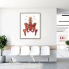 Framed hip & lower spine watercolor print in a clinic waiting room