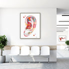 Framed human ear anatomy watercolor print in a clinic waiting room