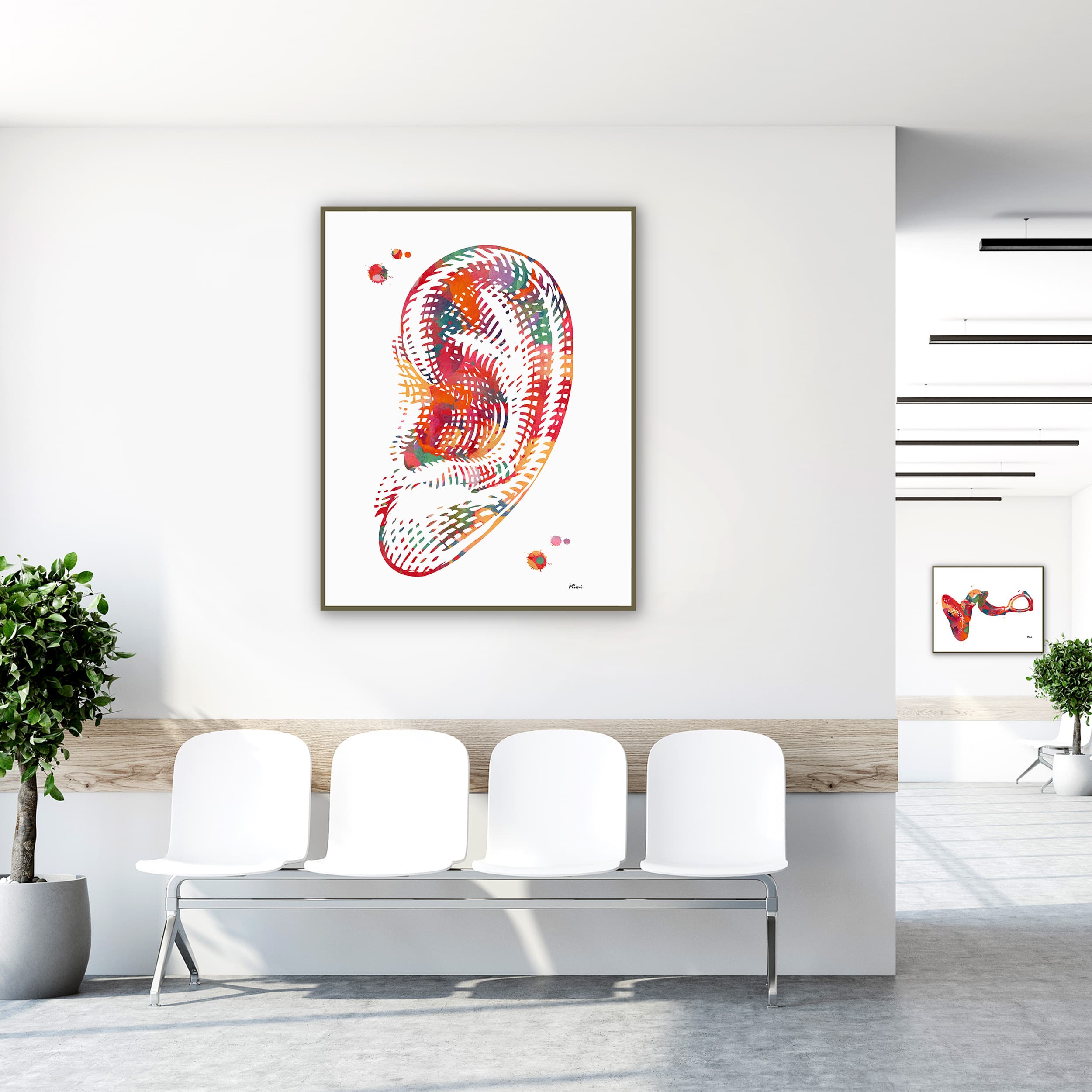 Framed human ear anatomy watercolor print in a clinic waiting room