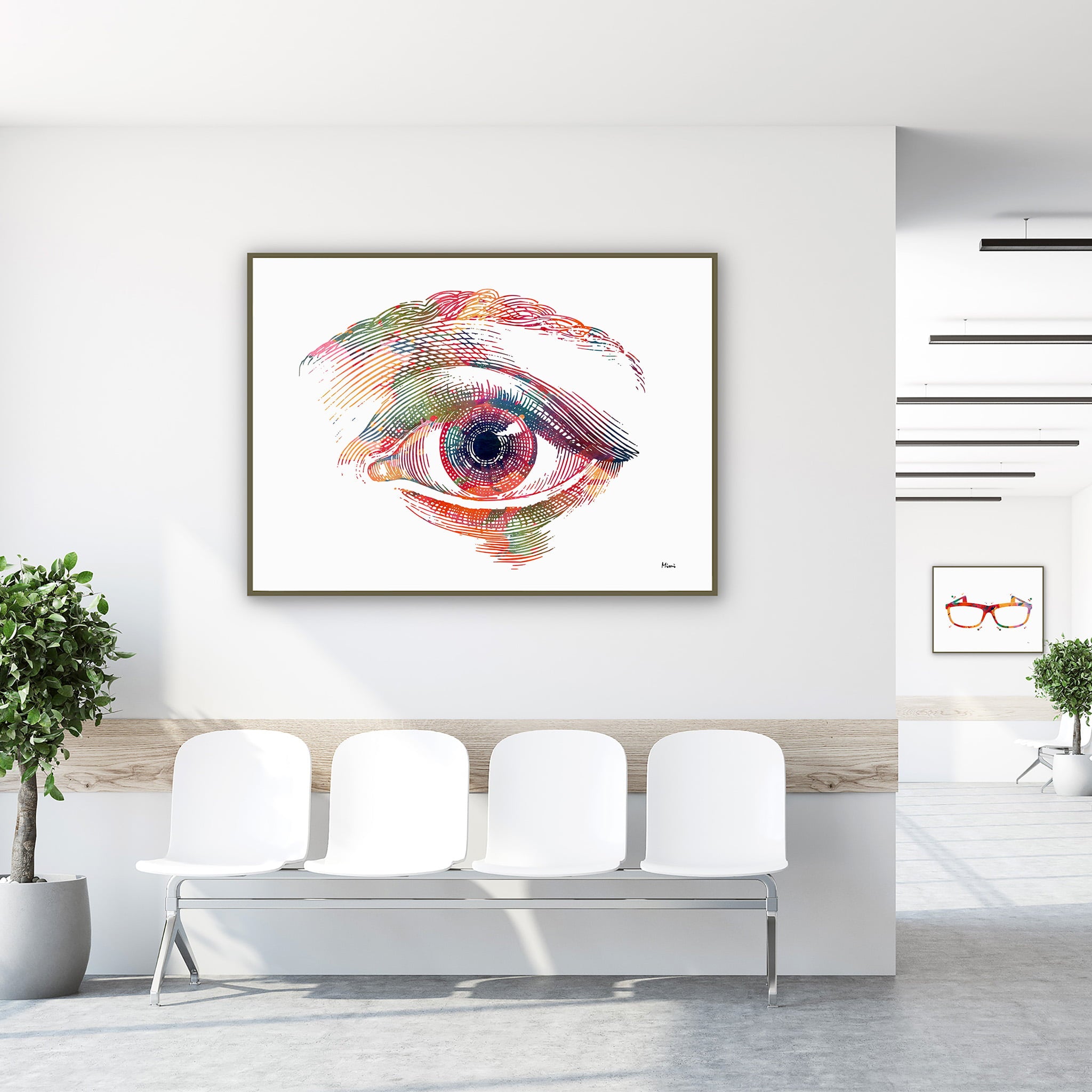 Framed human eye front view watercolor print in a clinic waiting room