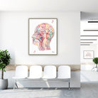Framed human head section anatomy watercolor print in a clinic waiting room