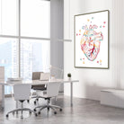 Framed human heart anatomy watercolor print in a cardiology clinic