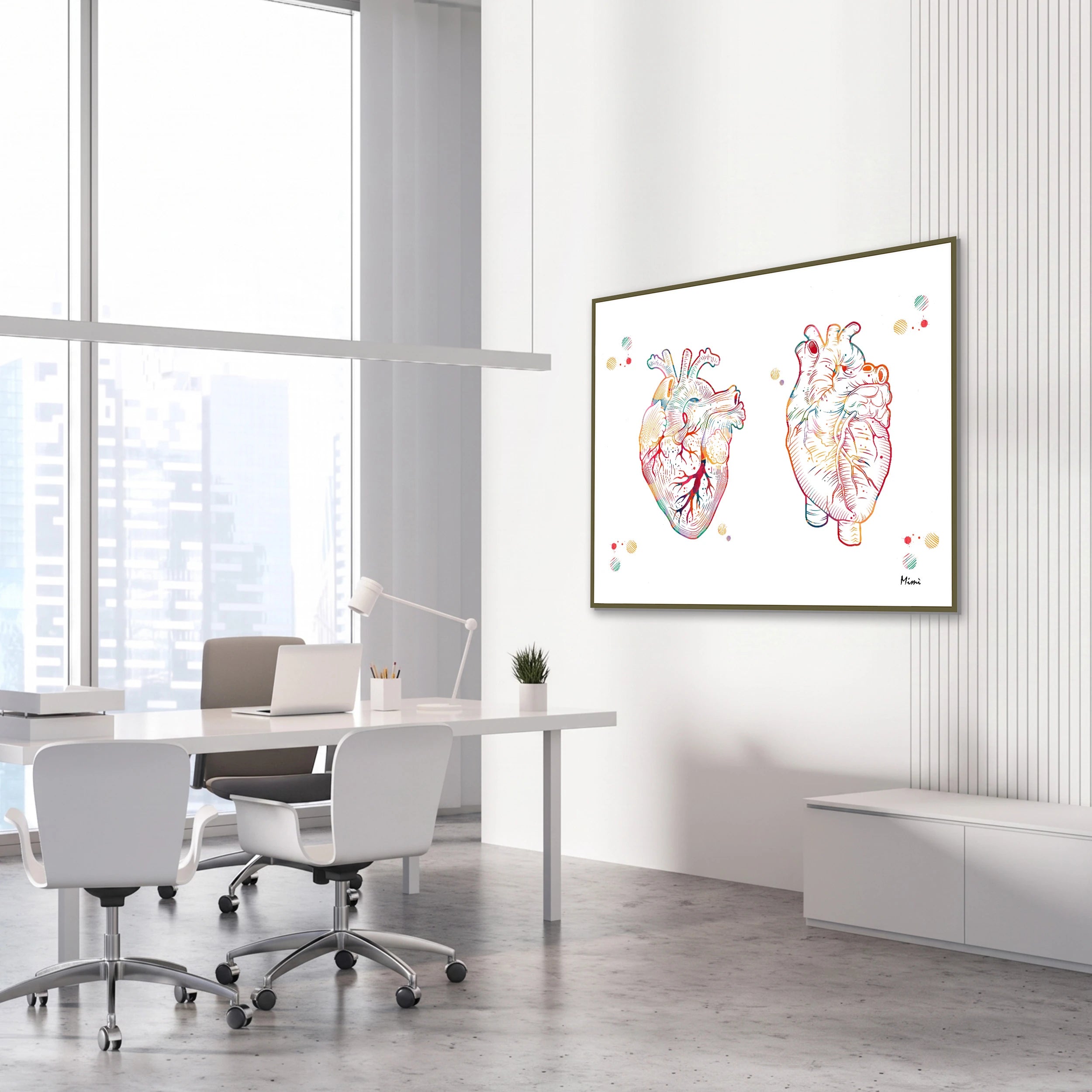 Framed human heart anterior and posterior view watercolor print in a cardiology clinic