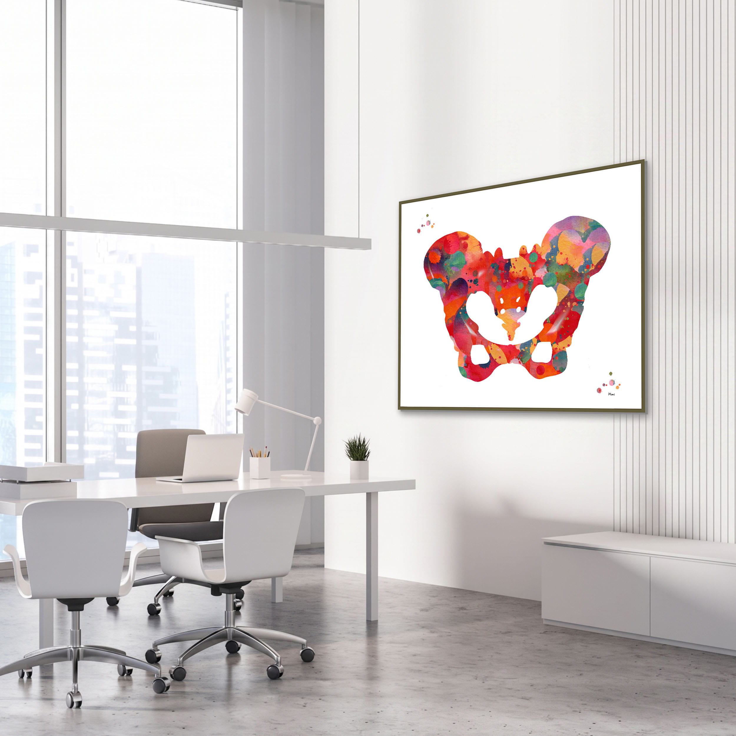 Framed human pelvis anatomy watercolor print in an orthopedic clinic