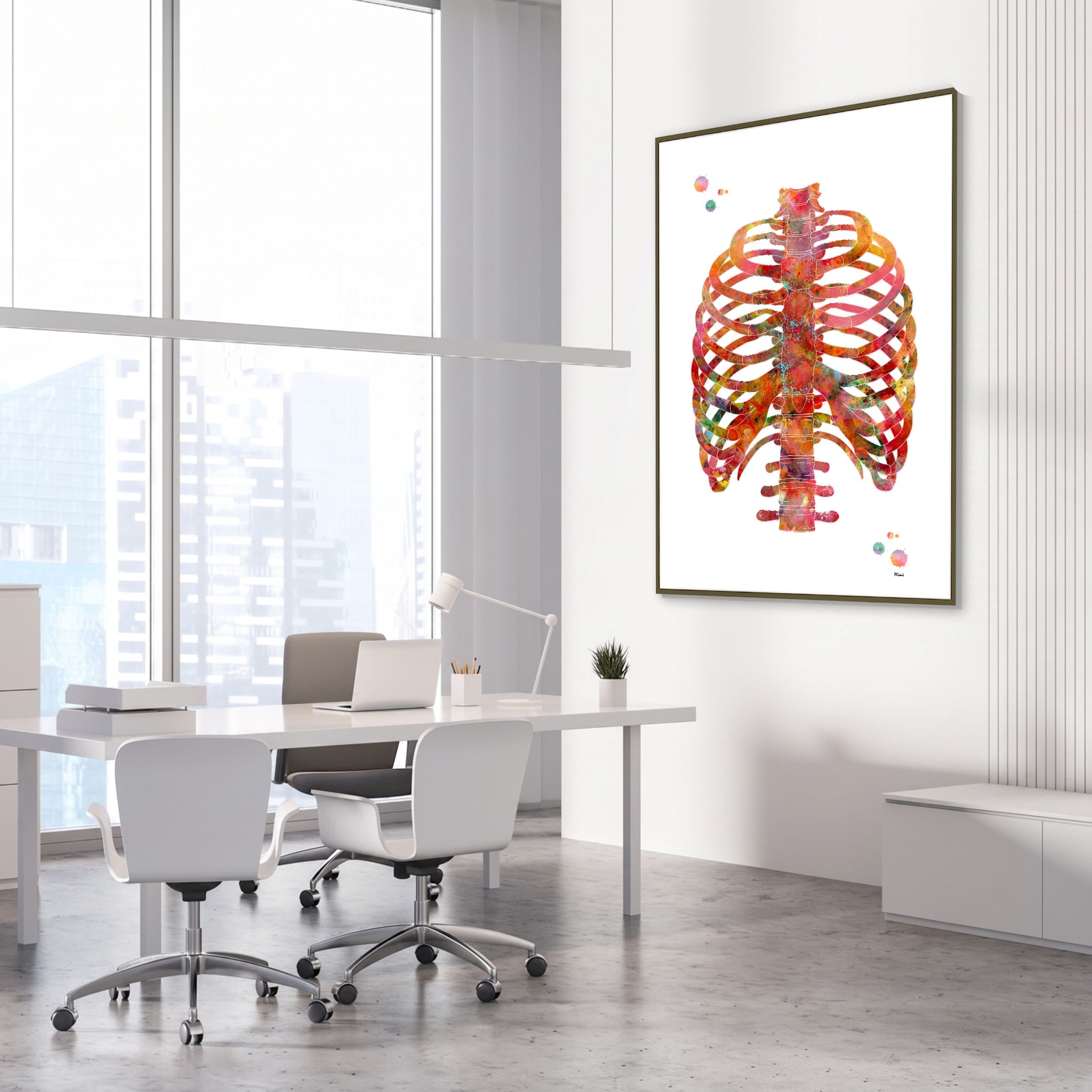 Framed human rib cage anatomy watercolor print in an orthopedic clinic