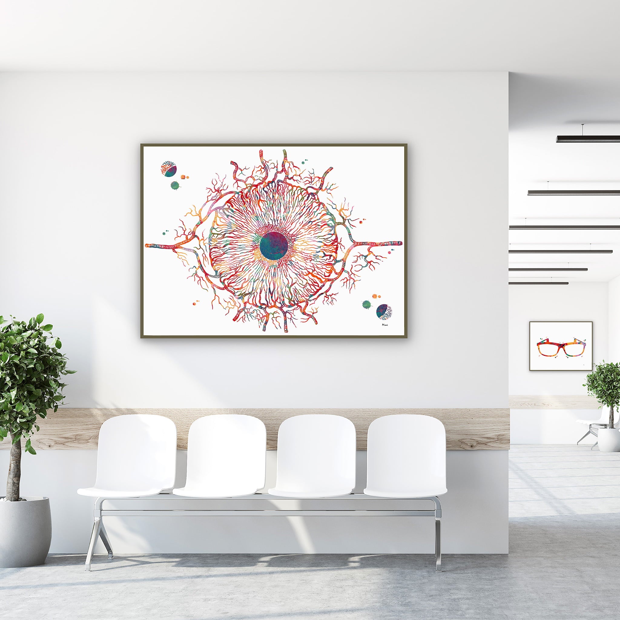 Framed iris anatomy watercolor print in a clinic waiting room