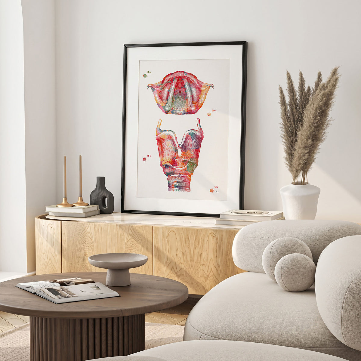 Framed larynx watercolor print in a warm living room