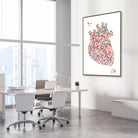 Framed minimalist geometric anatomical heart watercolor print in a cardiology clinic