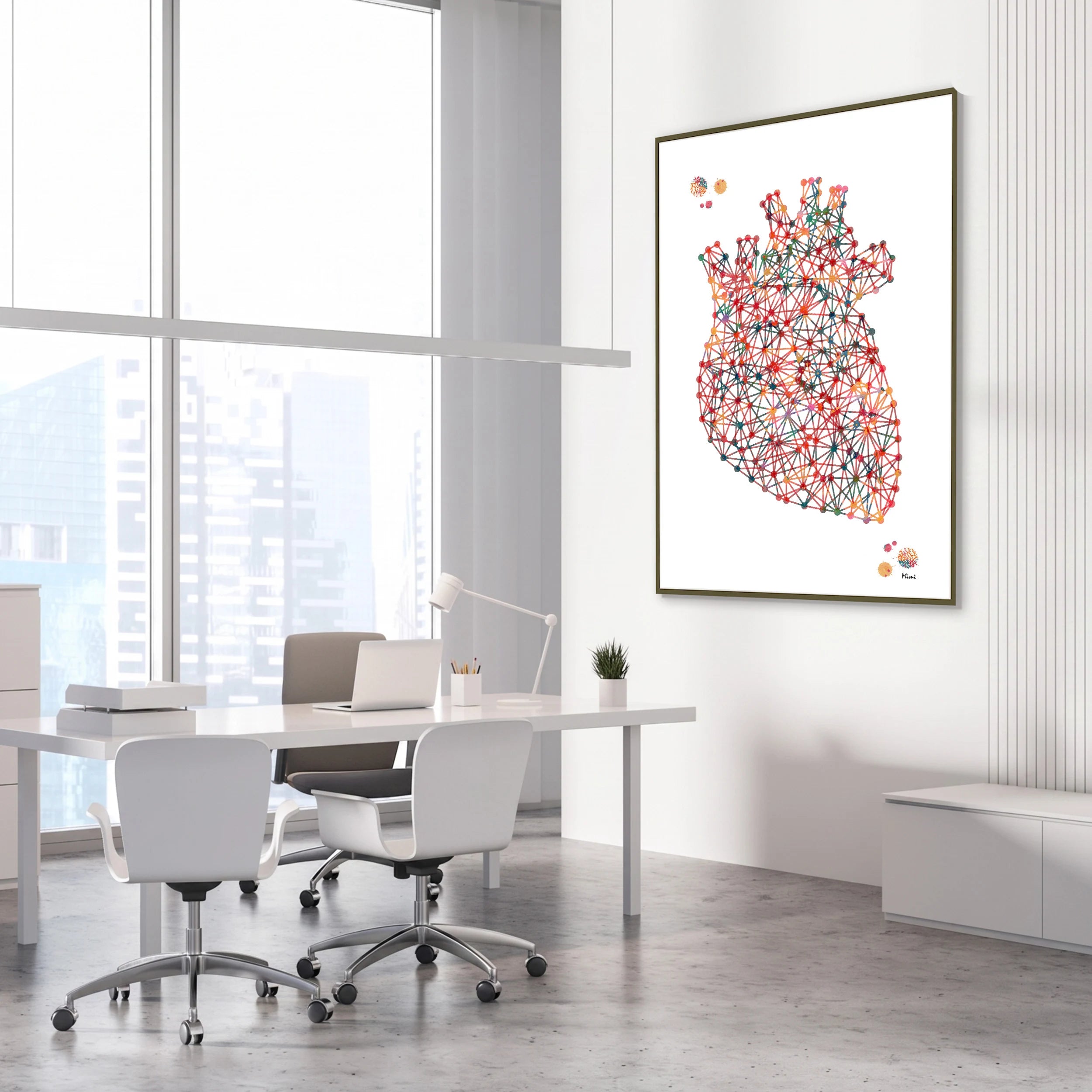 Framed minimalist geometric anatomical heart watercolor print in a cardiology clinic