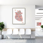 Framed minimalist geometric anatomical heart watercolor print in a clinic waiting room