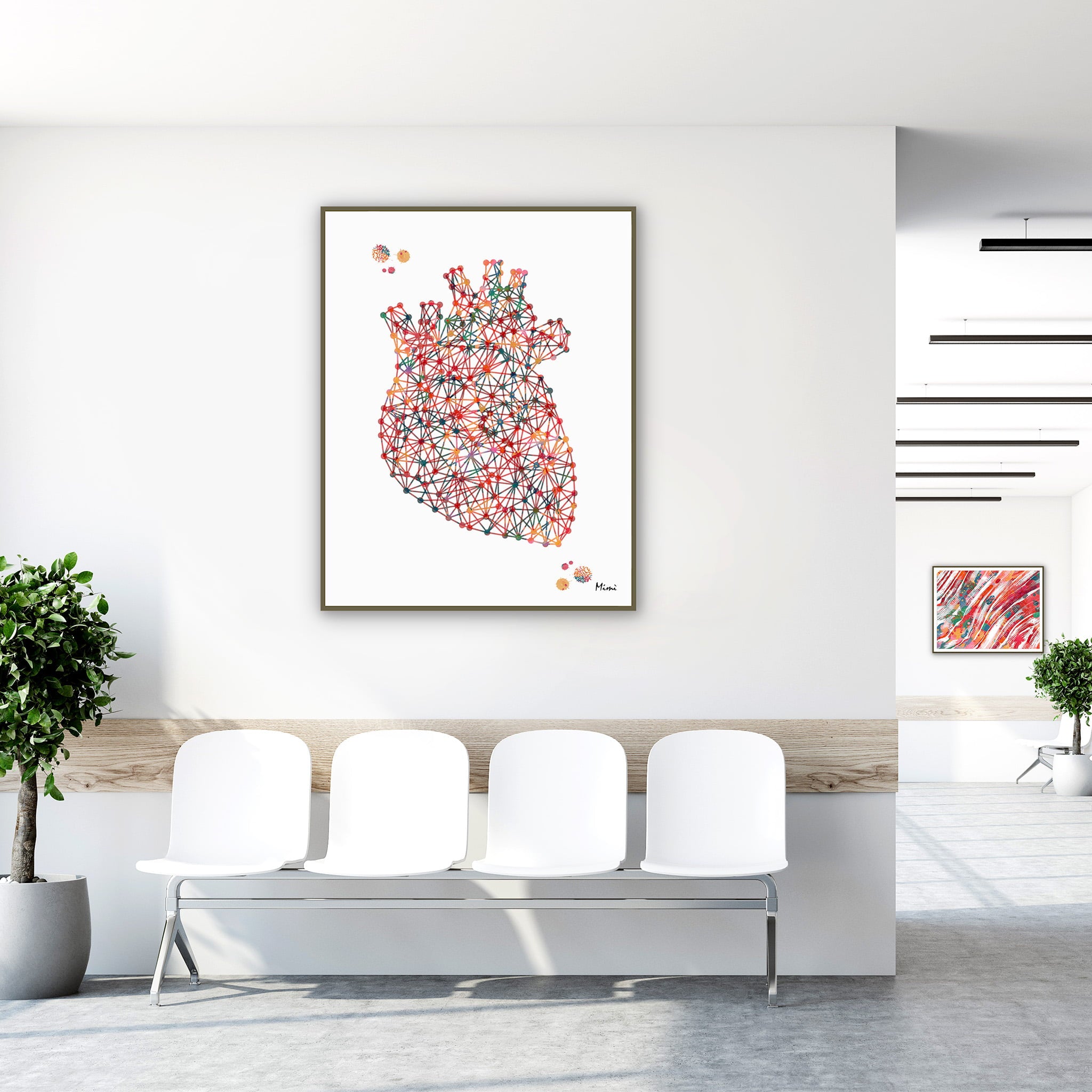 Framed minimalist geometric anatomical heart watercolor print in a clinic waiting room