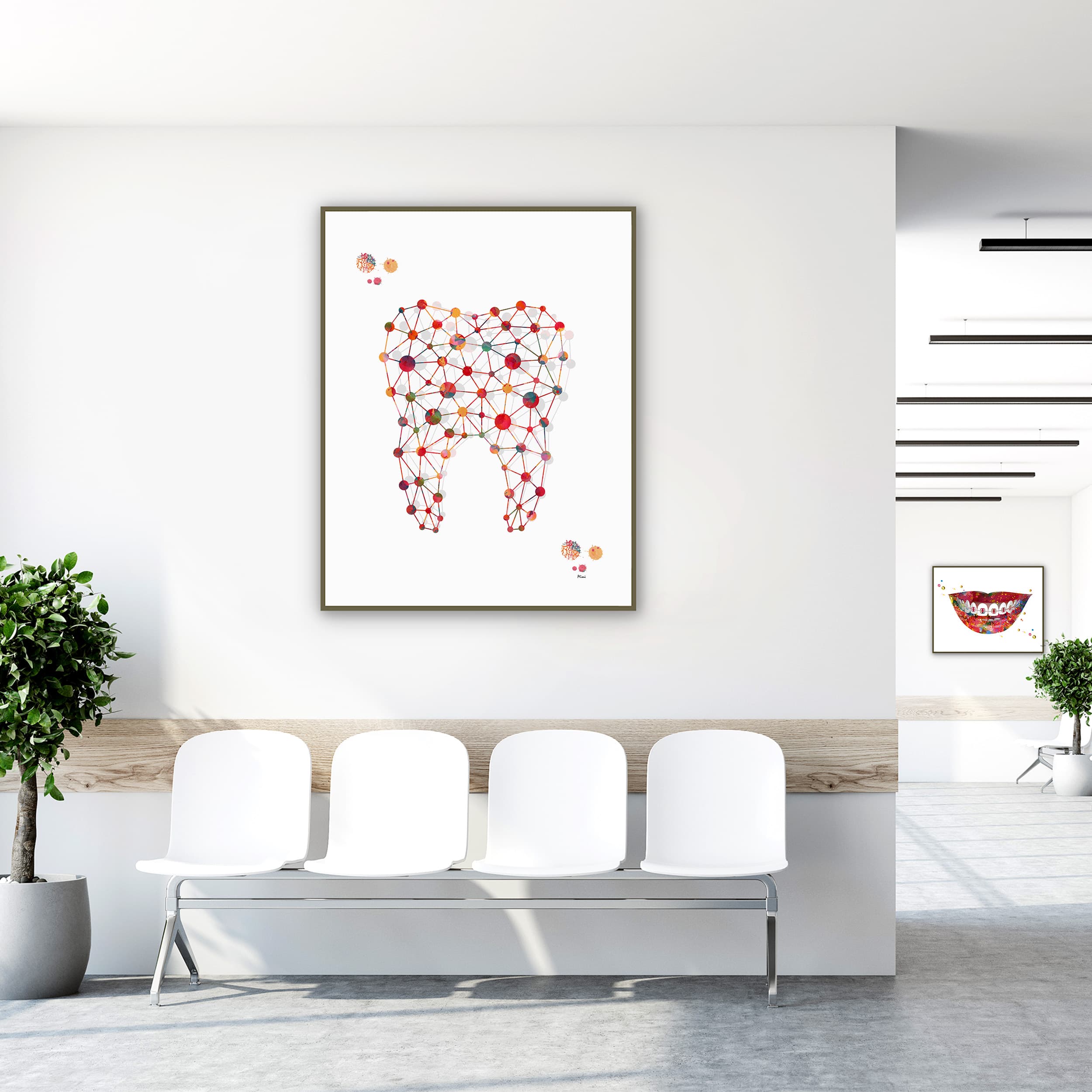Framed minimalist molar watercolor print in a clinic waiting room