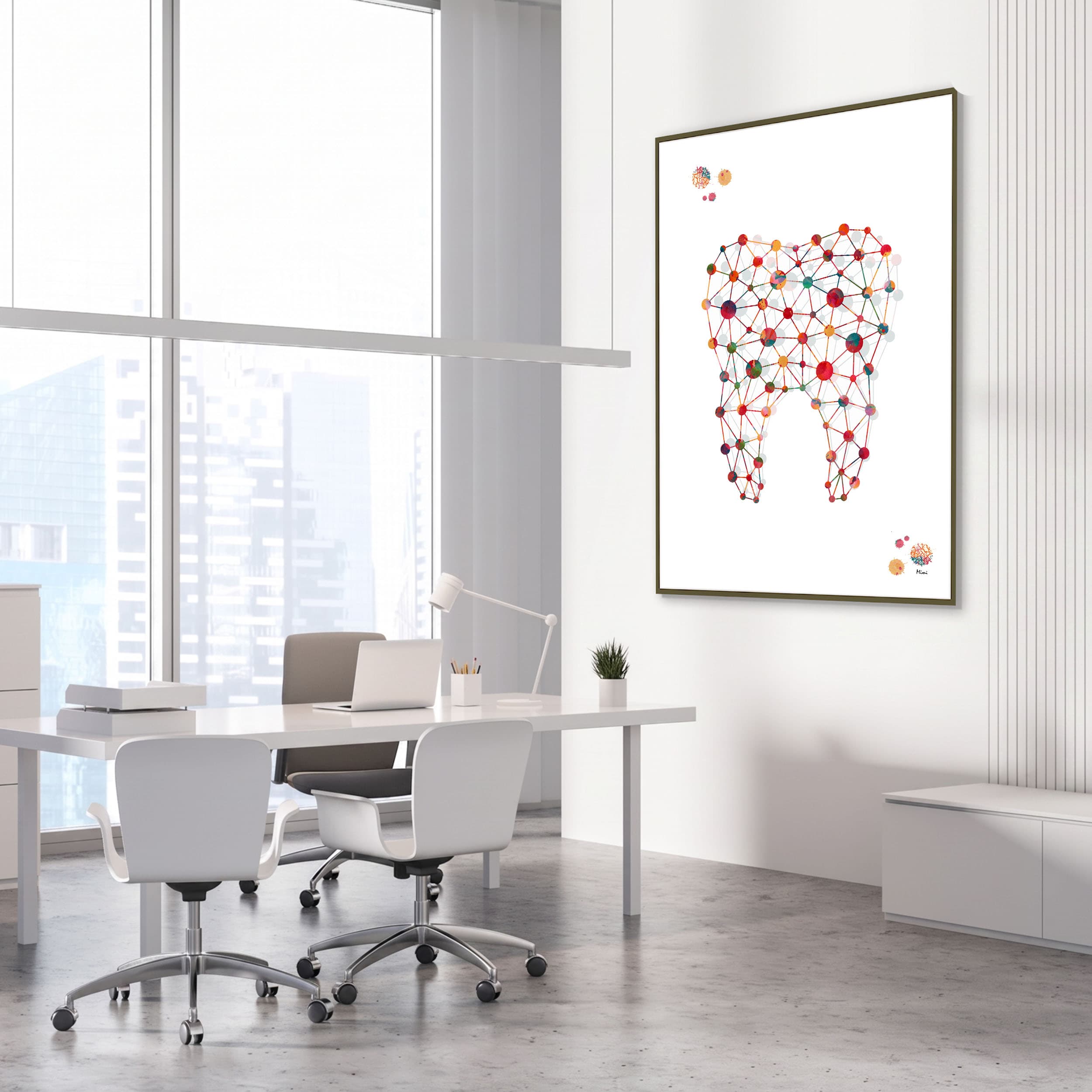 Framed minimalist molar watercolor print in a dental clinic office