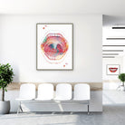 Framed mouth anatomy watercolor print in a clinic waiting room