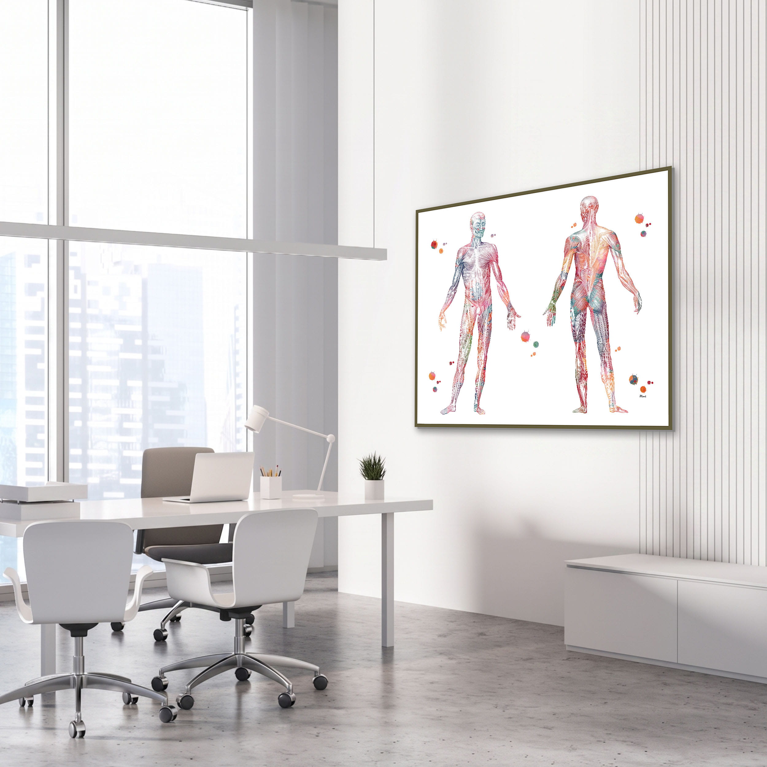 Framed muscular system anatomy watercolor print in an orthopedic clinic